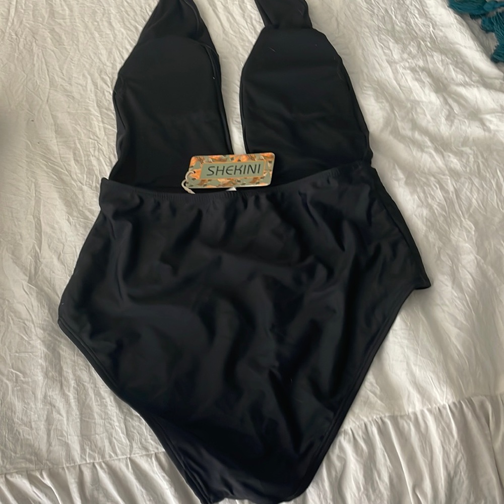 Shekini. Plunging v retro look bathing suit. Very flattering!